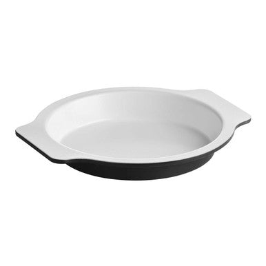 White ceramic baking dish with black interior on a white background