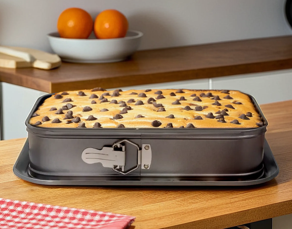 Baked dish in a non-stick baking pan on a kitchen counter with &