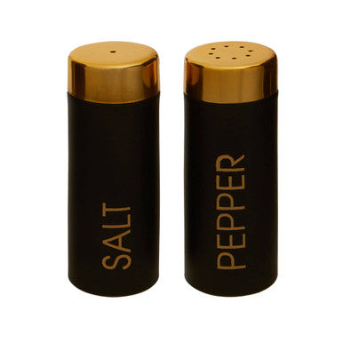 Black salt and pepper shakers with gold tops on a white background