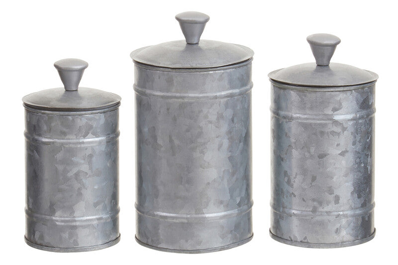 Set of three metallic canisters with lids on a white background