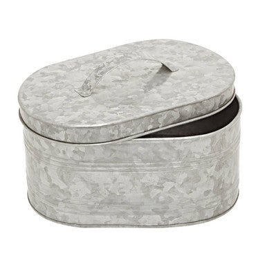 Marble-patterned oval tin box on a white background