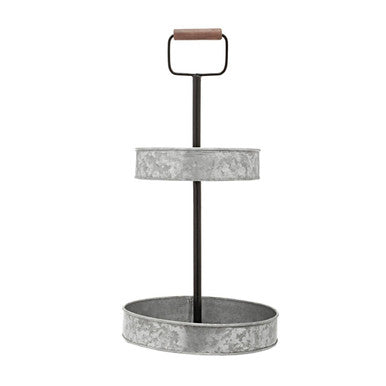 Two-tiered metal stand with a handle on a white background