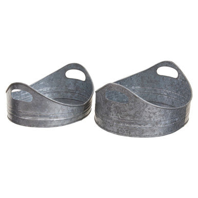 Two metal planters with handles on a white background