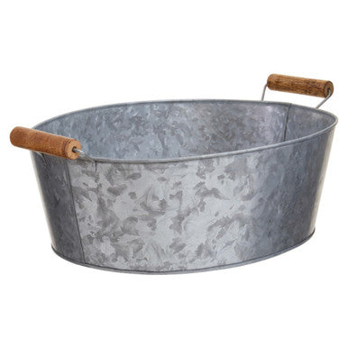 Metal basin with wooden handles on a white background