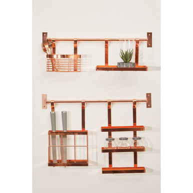 Set of copper wall shelves with decorative items on a white background