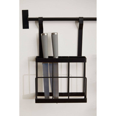 Black wall-mounted knife holder with two knives on a white background