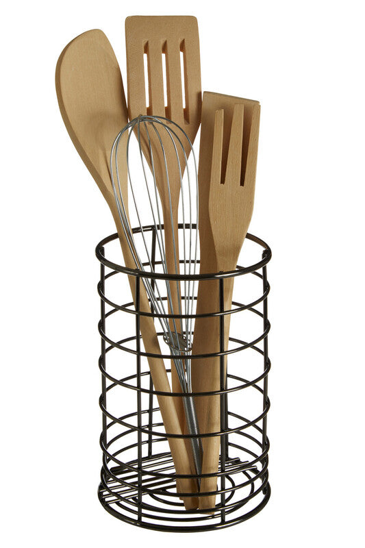 Set of wooden kitchen utensils in a black wire holder on a white background