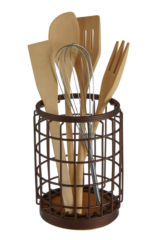 Set of kitchen utensils including spatulas and a whisk in a brown wire holder on a white background