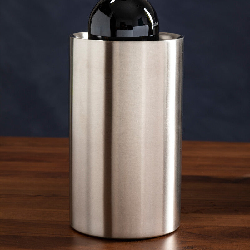 Stainless steel wine cooler with a bottle of red wine on a wooden surface and dark background