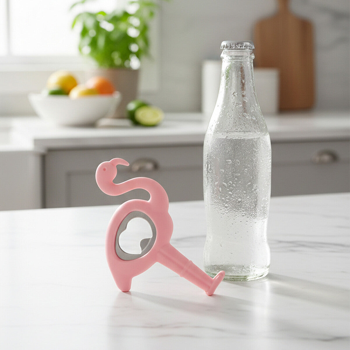 Pink flamingo bottle opener on a kitchen counter with a bottle of water.