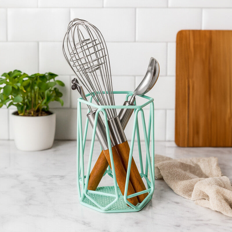 Kitchen utensil holder with utensils on a kitchen counter