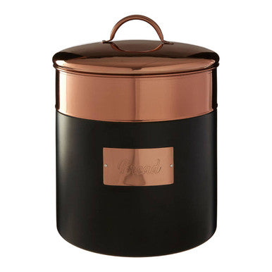 Copper and black storage jar with a lid on a white background