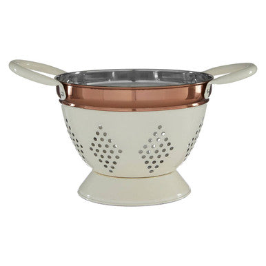 Colander with copper interior and white exterior on a white background