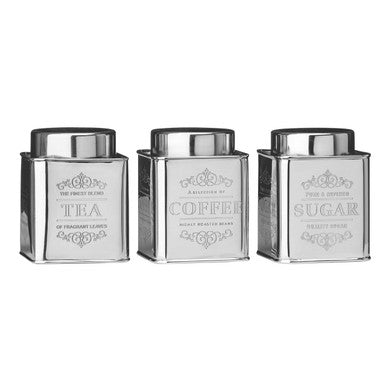 Three silver canisters labeled &