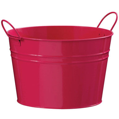 Red metal bucket with handles on a white background