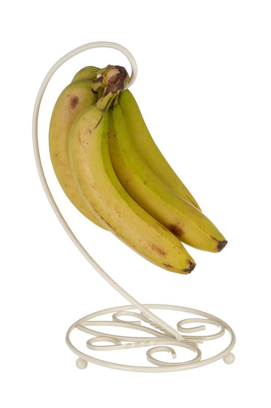 Bananas on a decorative metal stand against a white background