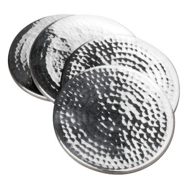 Set of three round metallic coasters with a textured surface on a white background