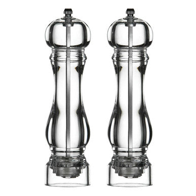 Two clear glass salt and pepper shakers on a white background