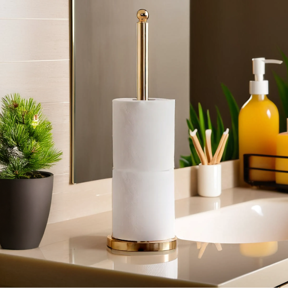 Bathroom counter with a marble-textured toilet brush holder, plant, and toiletries.