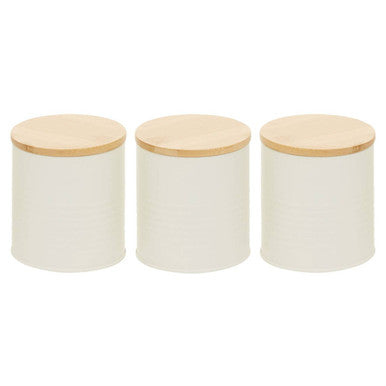 Three white canisters with wooden lids on a white background