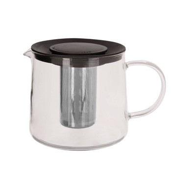 Clear glass teapot with black lid and handle on a white background