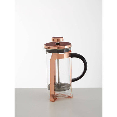 Copper French press coffee maker on a white background