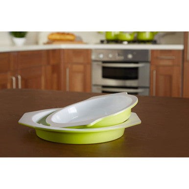 Green and white silicone baking dish on a kitchen counter