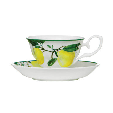 Teacup and saucer with lemon design on a white background