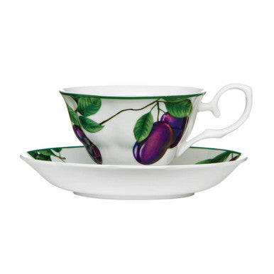 Teacup and saucer with eggplant design on a white background