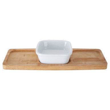 White square bowl on a wooden tray with a white background
