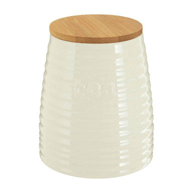 White textured storage jar with a wooden lid on a white background