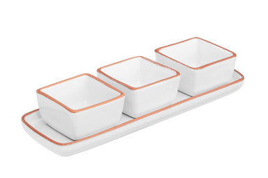 Set of three square ceramic bowls with a white tray on a white background