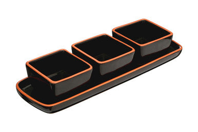Black ceramic dish set with orange rims on a white background
