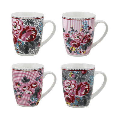 Set of four floral mugs with different patterns on a white background