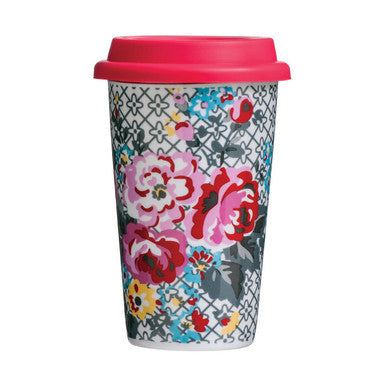 Travel mug with floral design and pink lid on a white background