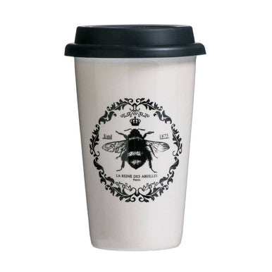White travel mug with black lid featuring a bee design on a white background