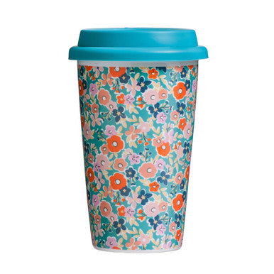 Floral-patterned travel mug with a blue lid on a white background