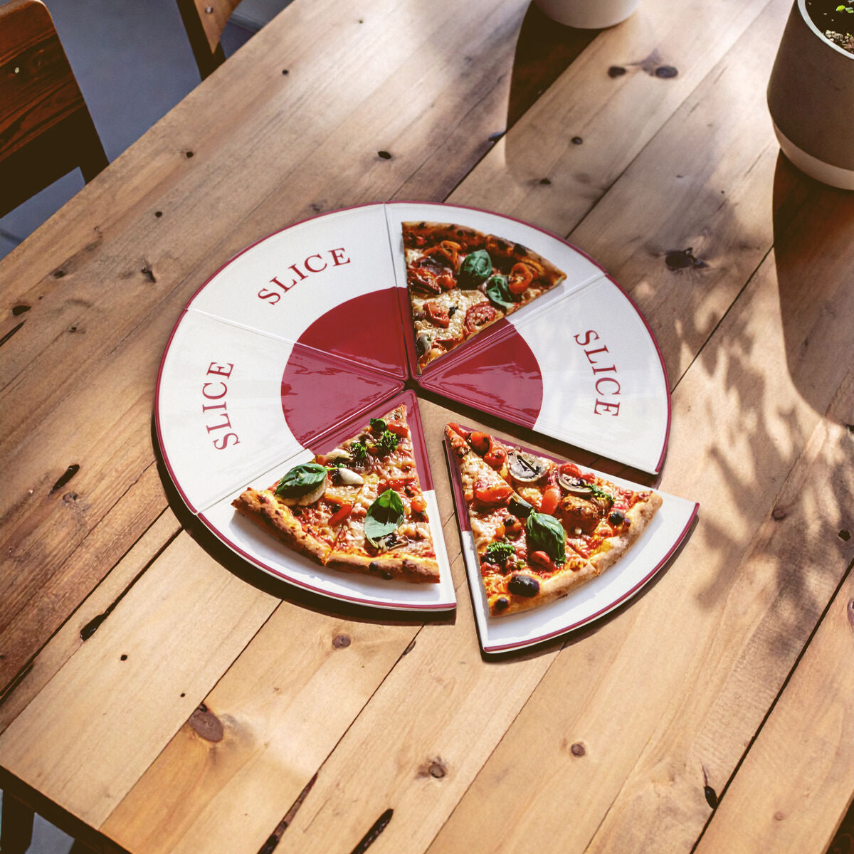 Pizza with slices on a round tray labeled &