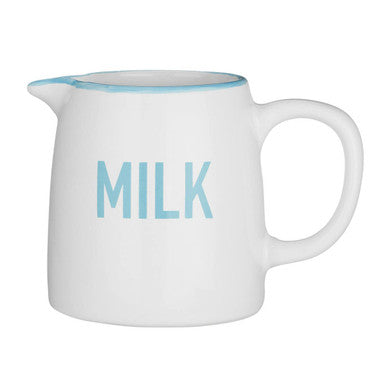 White milk pitcher with blue interior and handle on a white background