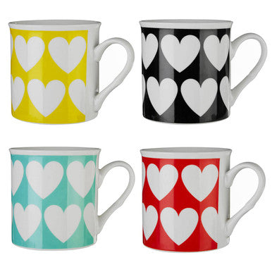 Four mugs with heart patterns in yellow, black, green, and red on a white background.