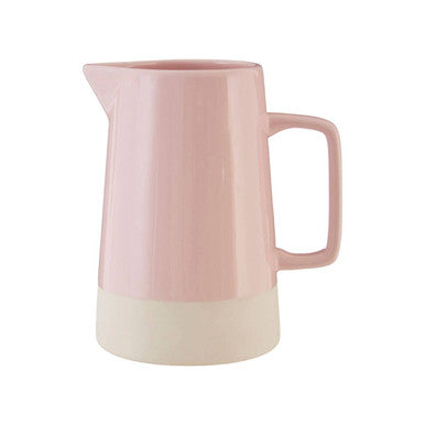 Pink ceramic pitcher on a white background