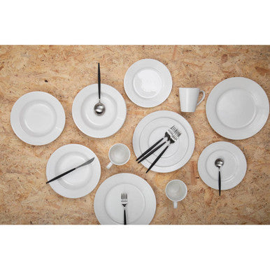 Set of white dinnerware on a wooden surface