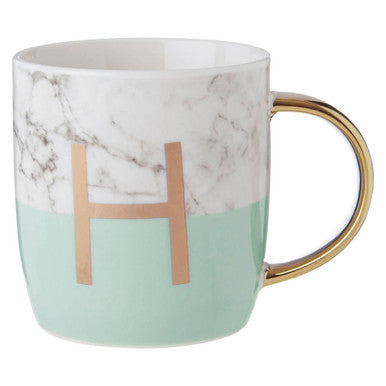 Marble-patterned mug with a gold handle and letter &