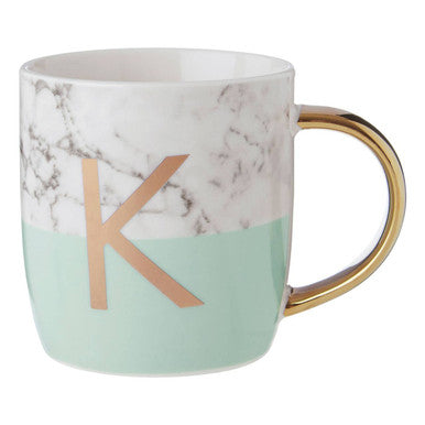 Marble-patterned mug with a gold handle and letter &