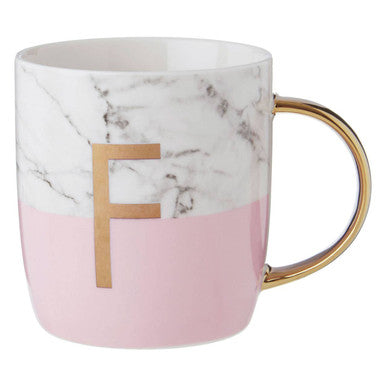 Marble-patterned mug with pink base and gold handle and letter &