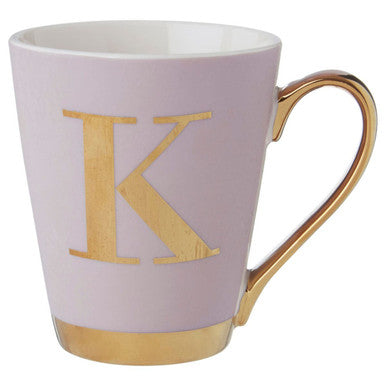 Pink mug with gold handle and letter &