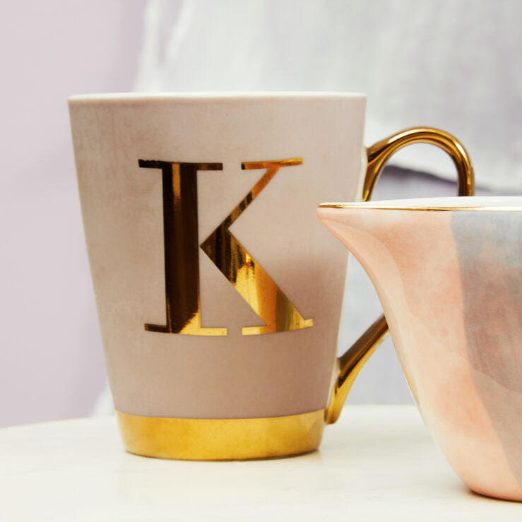 Beige mug with gold letter &