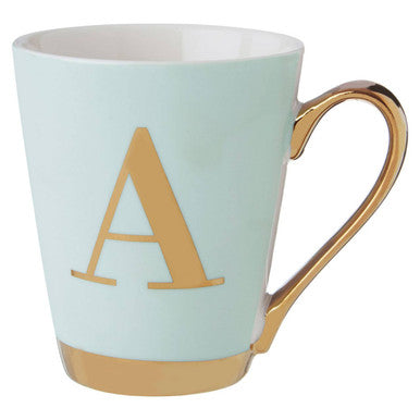 Mint green mug with gold handle and letter &