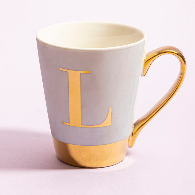 White mug with gold letter &