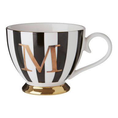 Black and white striped mug with gold letter &
